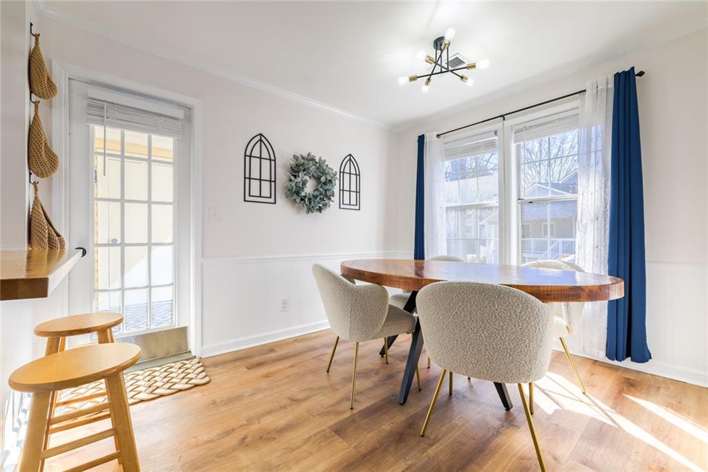 404 Countryside Place Smyrna, GA 30080 - Photo 8 of 36 a dining room with wooden floor and a window