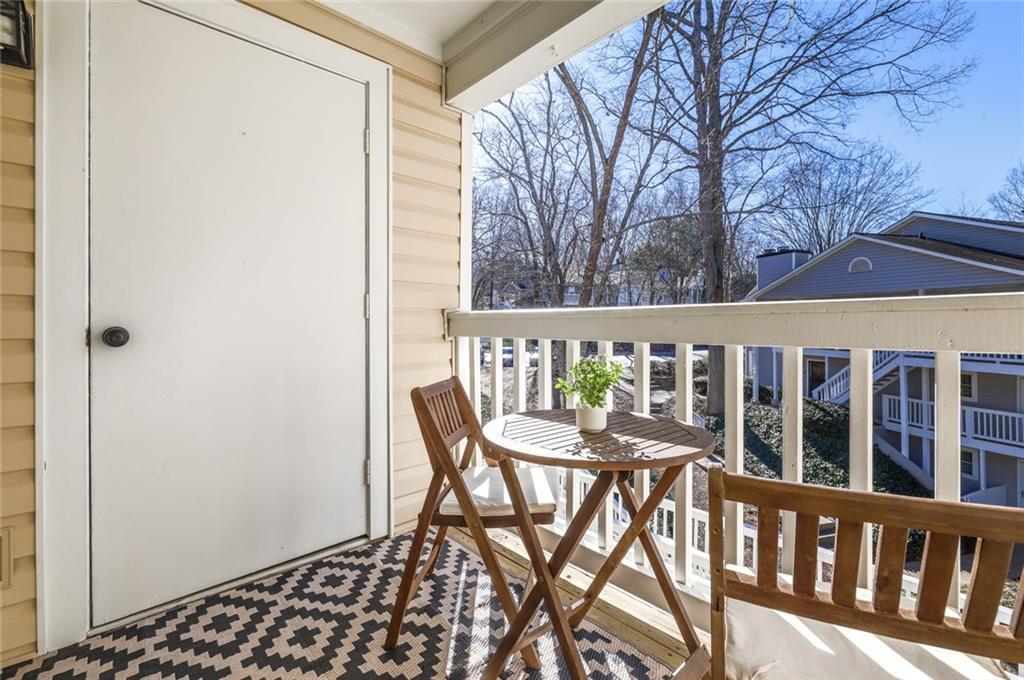 404 Countryside Place Smyrna, GA 30080 - Photo 10 of 36 a view of a wooden chairs and table in the balcony