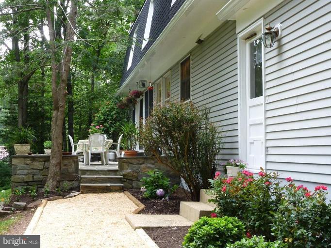 11615 Foxclove Road Reston, VA 20191 - Photo 3 of 30 a view of backyard with sitting area and garden