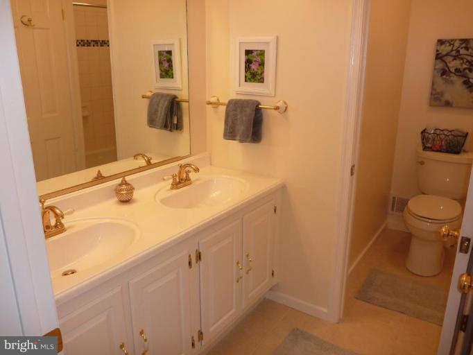 11615 Foxclove Road Reston, VA 20191 - Photo 21 of 30 a bathroom with a sink and a mirror
