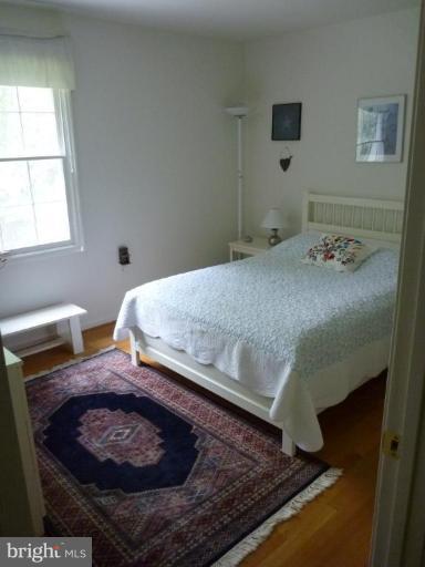 11615 Foxclove Road Reston, VA 20191 - Photo 24 of 30 a bed sitting in a bedroom next to a window
