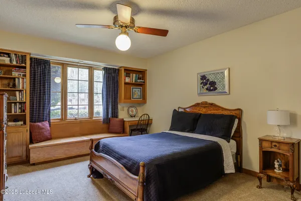 a bedroom with a bed and a couch