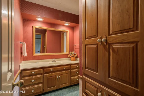 a bathroom with a sink and a mirror
