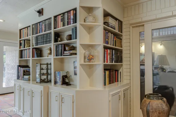 a workspace with a book shelf