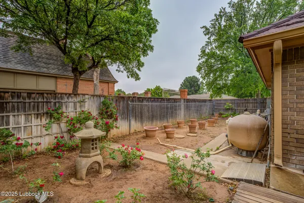 a backyard of a house with outdoor seating