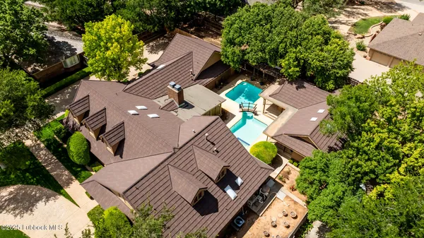 an aerial view of a house with a garden