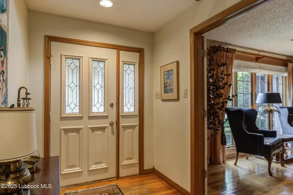 a view of a livingroom with furniture and front door