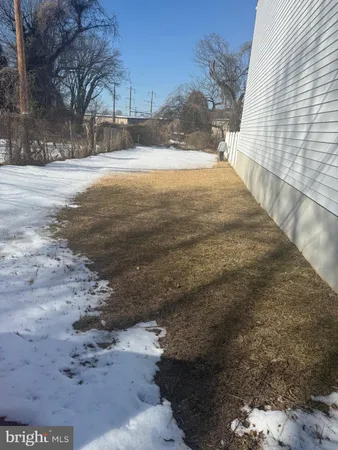 a view of empty space with large trees