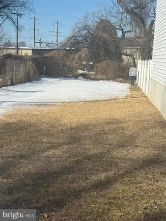 a view of a backyard of the house
