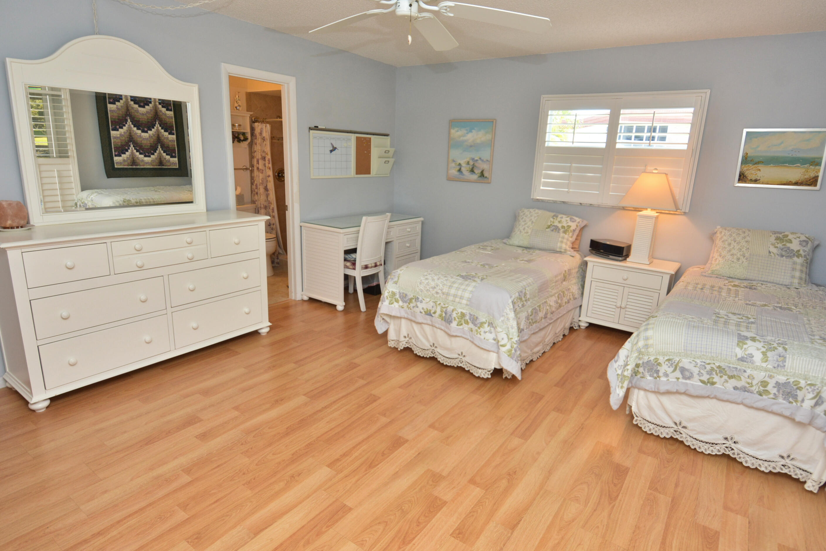 1225 Northwest 21st Street, Unit 203 Stuart, FL 34994 - Photo 24 of 44 a bedroom with a bed and window