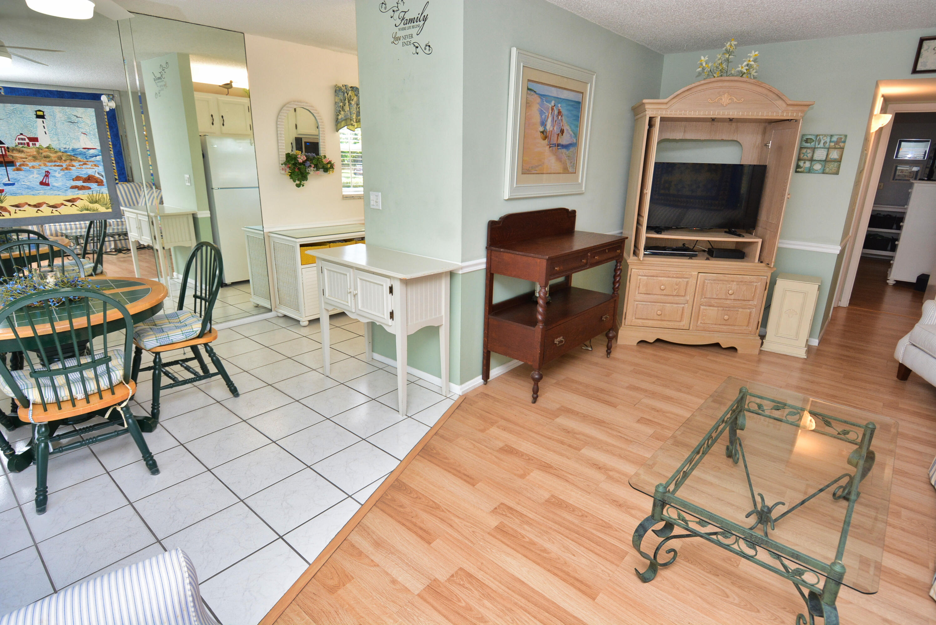 1225 Northwest 21st Street, Unit 203 Stuart, FL 34994 - Photo 8 of 44 a bedroom with a bed and a chair in it