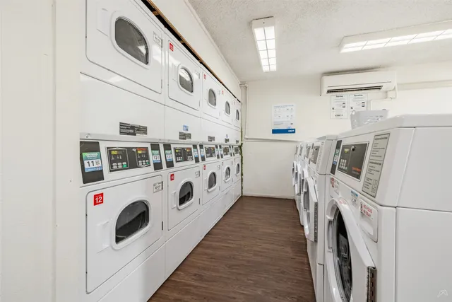 a living room with furniture a table and a large window