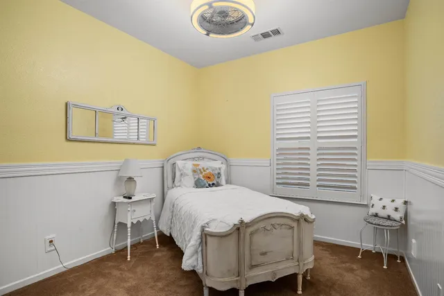 a view of a bedroom with wooden floor and bedroom view