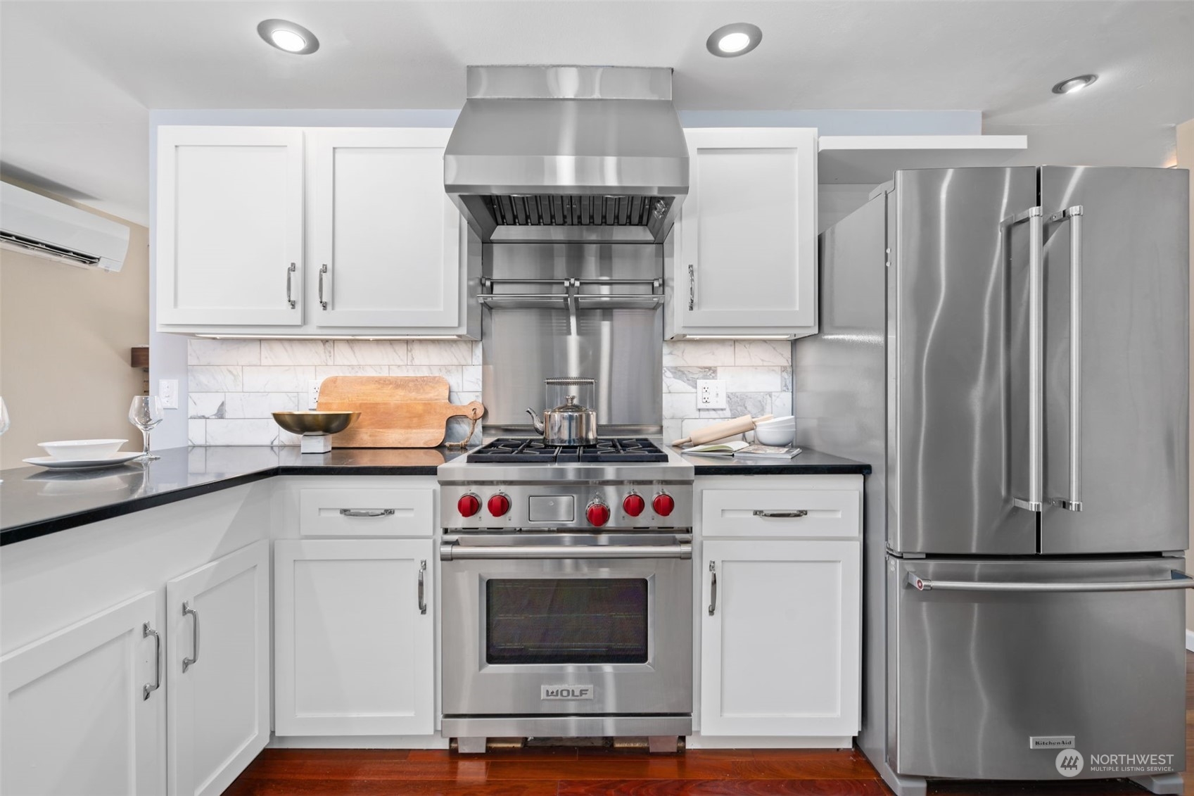 1313 North 28th Street Renton, WA 98056 - Photo 15 of 35 a kitchen with stainless steel appliances a stove and a refrigerator