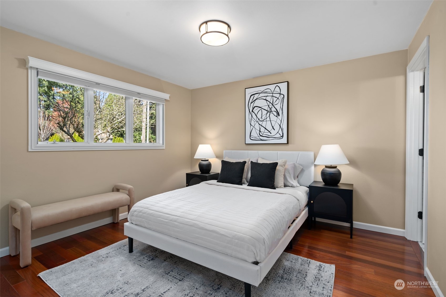 1313 North 28th Street Renton, WA 98056 - Photo 17 of 35 a bedroom with a bed and wooden floor
