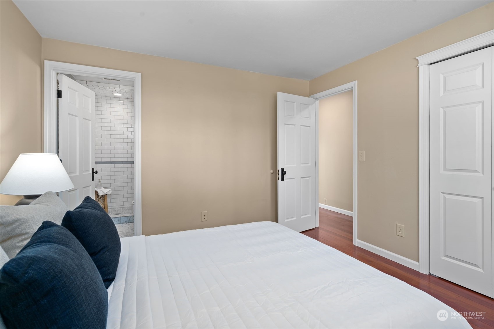 1313 North 28th Street Renton, WA 98056 - Photo 18 of 35 a bedroom with a bed and a lamp