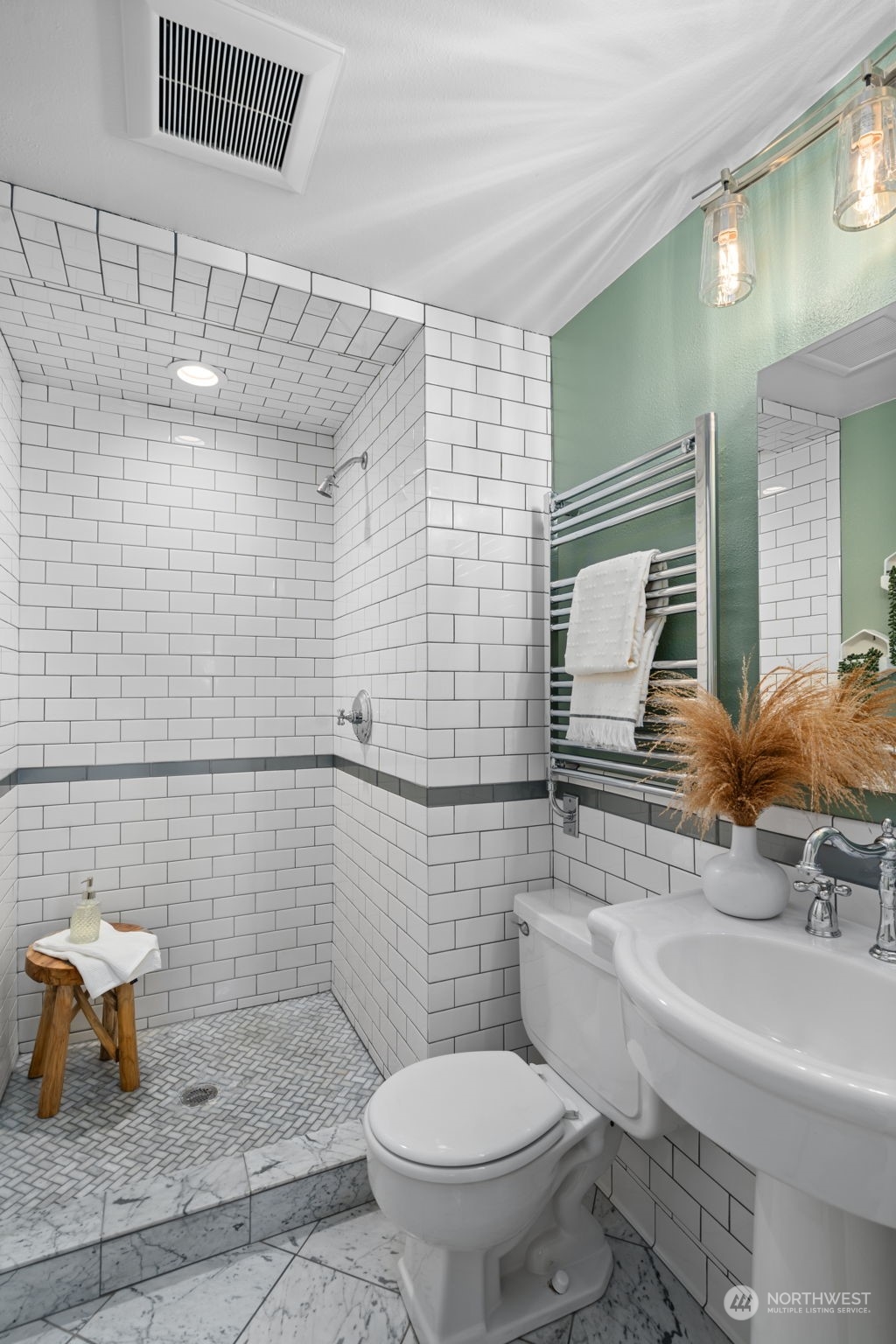 1313 North 28th Street Renton, WA 98056 - Photo 19 of 35 a bathroom with a sink a toilet and mirror