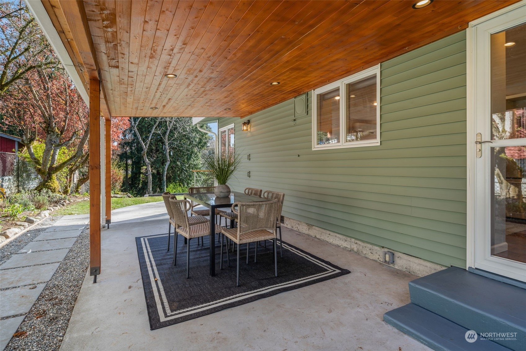 1313 North 28th Street Renton, WA 98056 - Photo 23 of 35 a view of a patio with a table chairs and backyard