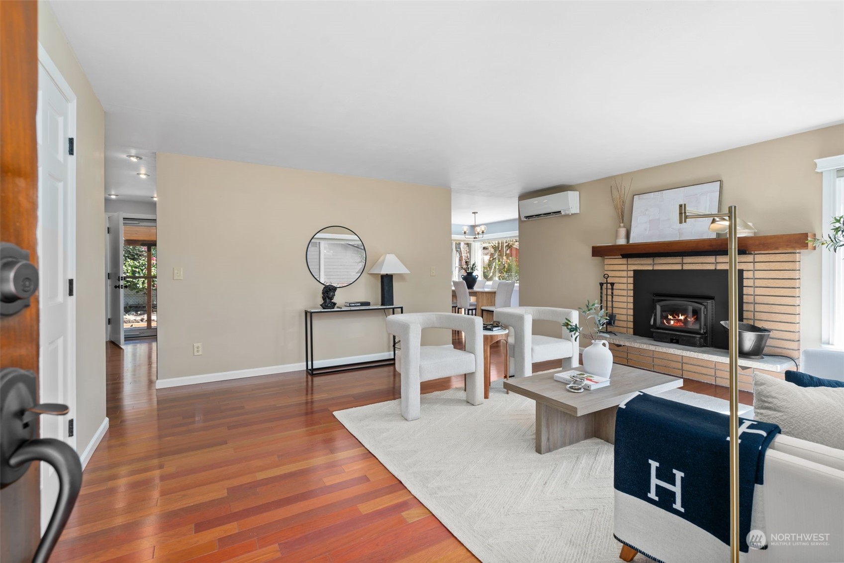 1313 North 28th Street Renton, WA 98056 - Photo 6 of 35 a living room with furniture a rug and a fireplace
