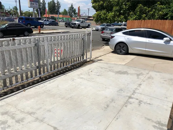 a view of outdoor space with wooden fence