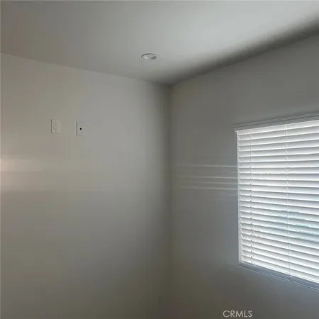 a view of a closet area with a window