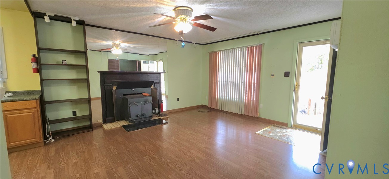 2071 Wickham Road Bumpass, VA 23024 - Photo 4 of 4 wooden floor in an empty room with a window