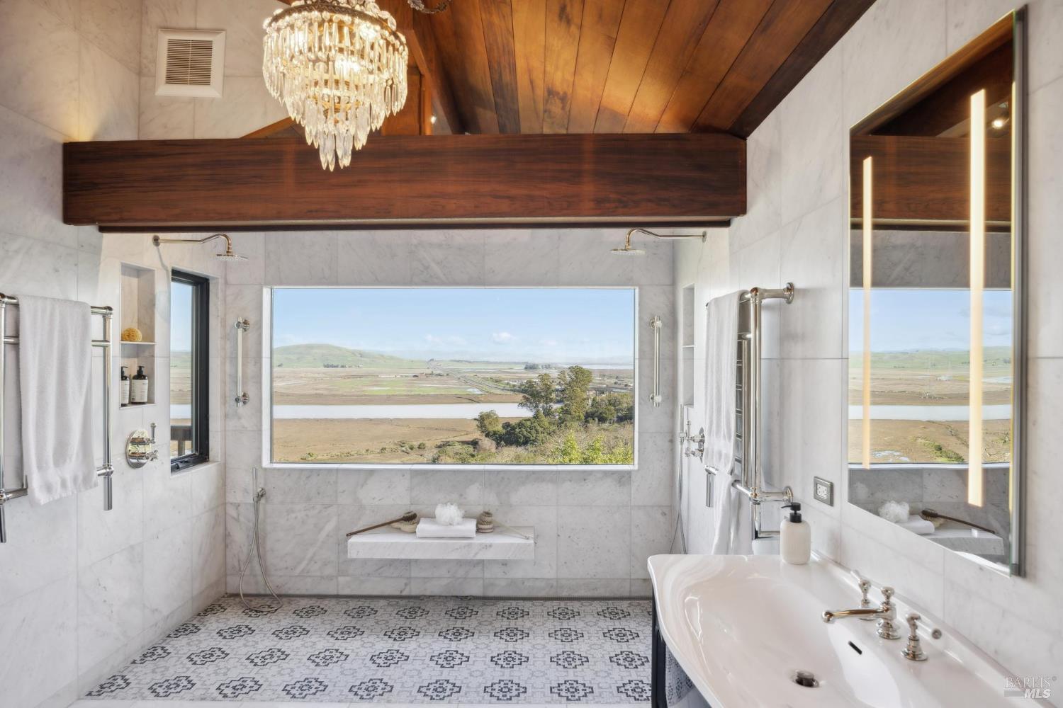 160 Crest Road Novato, CA 94945 - Photo 59 of 85 a bathroom with a sink a mirror and a window