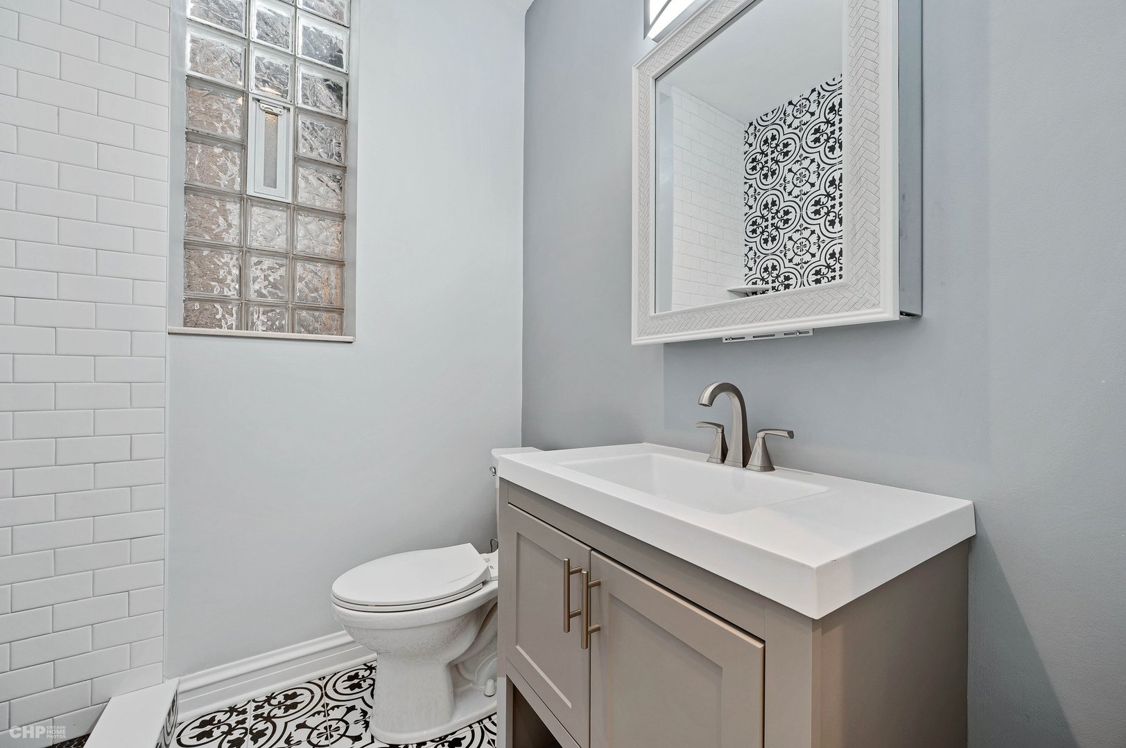 843 West Newport Avenue, Unit 2 Chicago, IL 60657 - Photo 11 of 26 a bathroom with a sink and a toilet