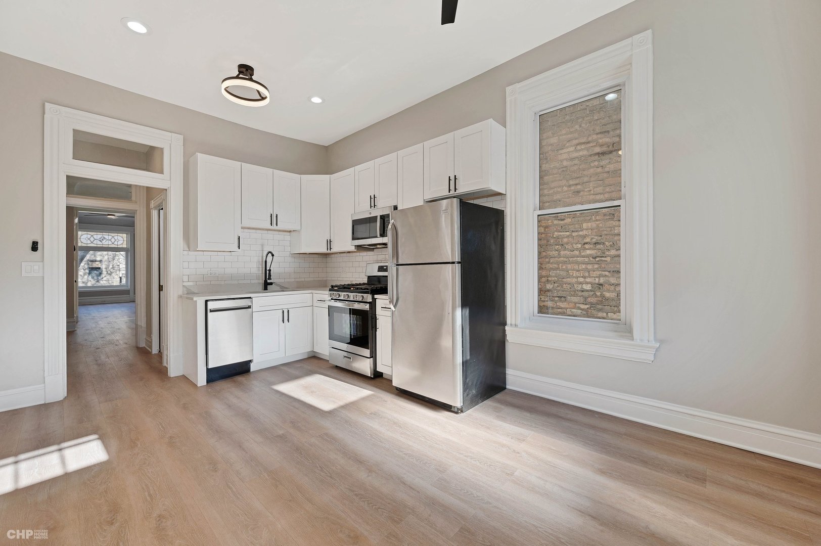 843 West Newport Avenue, Unit 2 Chicago, IL 60657 - Photo 19 of 26 a kitchen with stainless steel appliances a refrigerator and a stove top oven