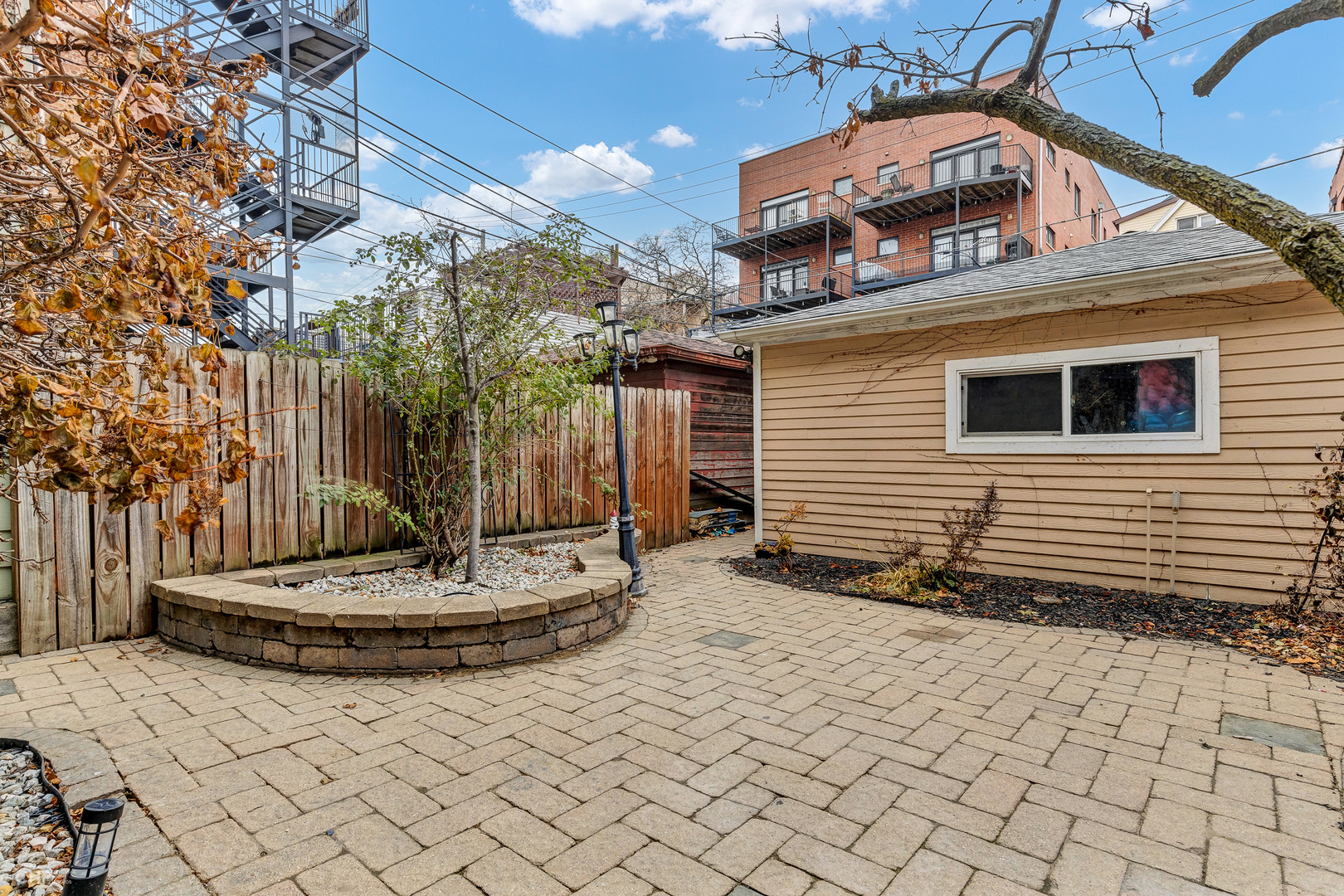 843 West Newport Avenue, Unit 2 Chicago, IL 60657 - Photo 23 of 26 a view of a house with backyard