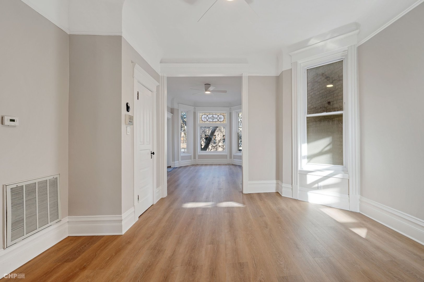 843 West Newport Avenue, Unit 2 Chicago, IL 60657 - Photo 8 of 26 a view of a hallway with wooden floor and closet