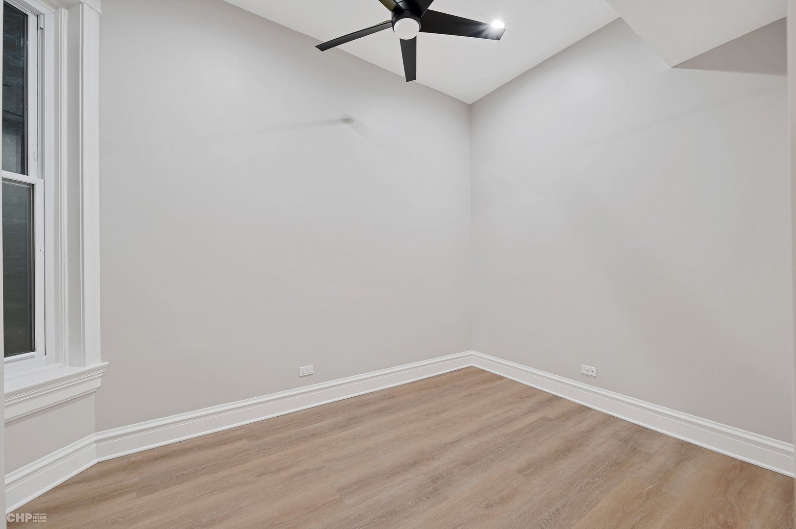 843 West Newport Avenue, Unit 2 Chicago, IL 60657 - Photo 9 of 26 wooden floor in an empty room