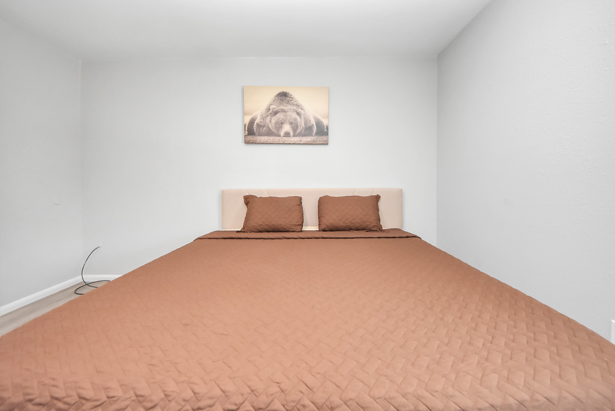 1011 Whitestone Lane Houston, TX 77073 - Photo 11 of 48 a bedroom with a bed and painting on the wall