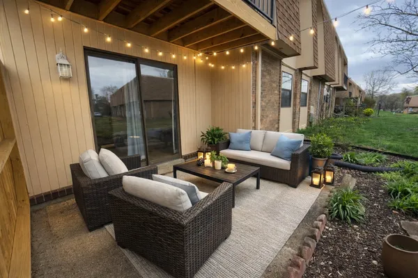 a outdoor living space with furniture and a fireplace