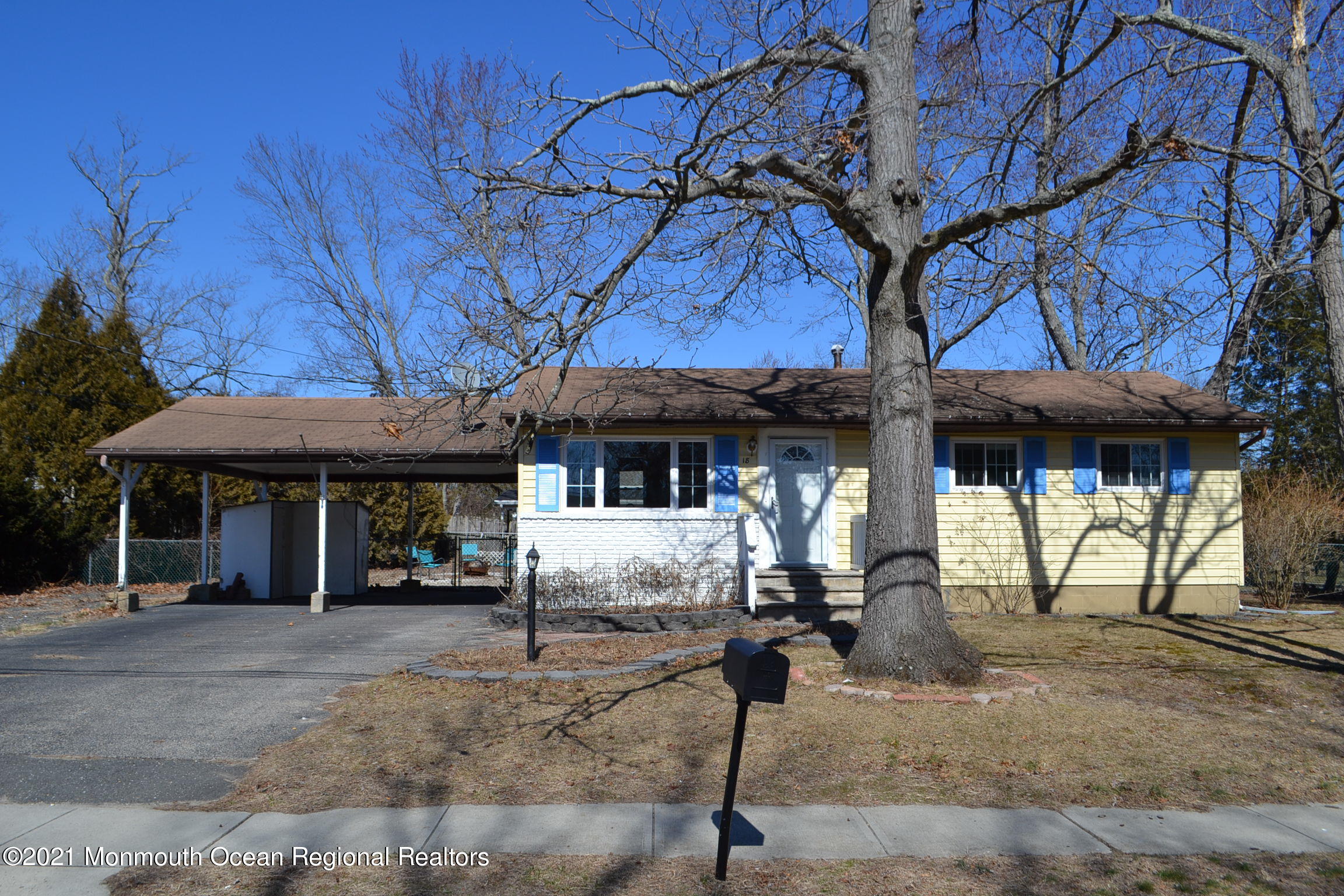 a view of a house with large trees