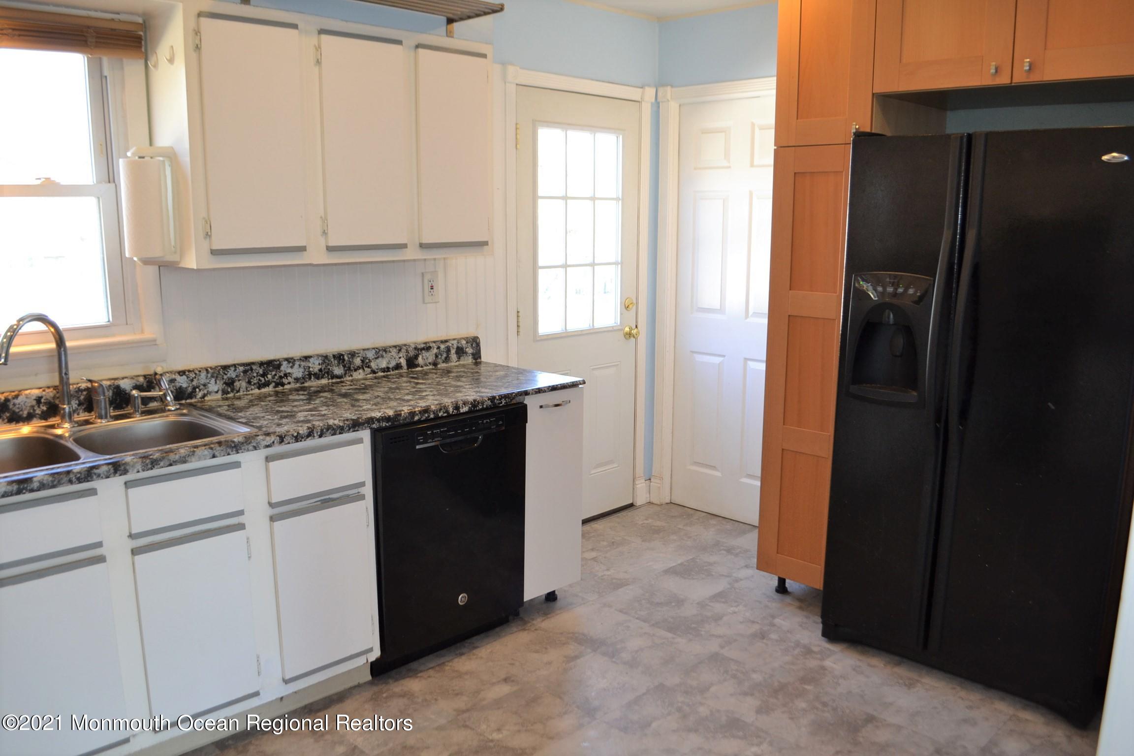 18 Castle Avenue Jackson, NJ 08527 - Photo 3 of 19 a kitchen with stainless steel appliances granite countertop a refrigerator and a sink
