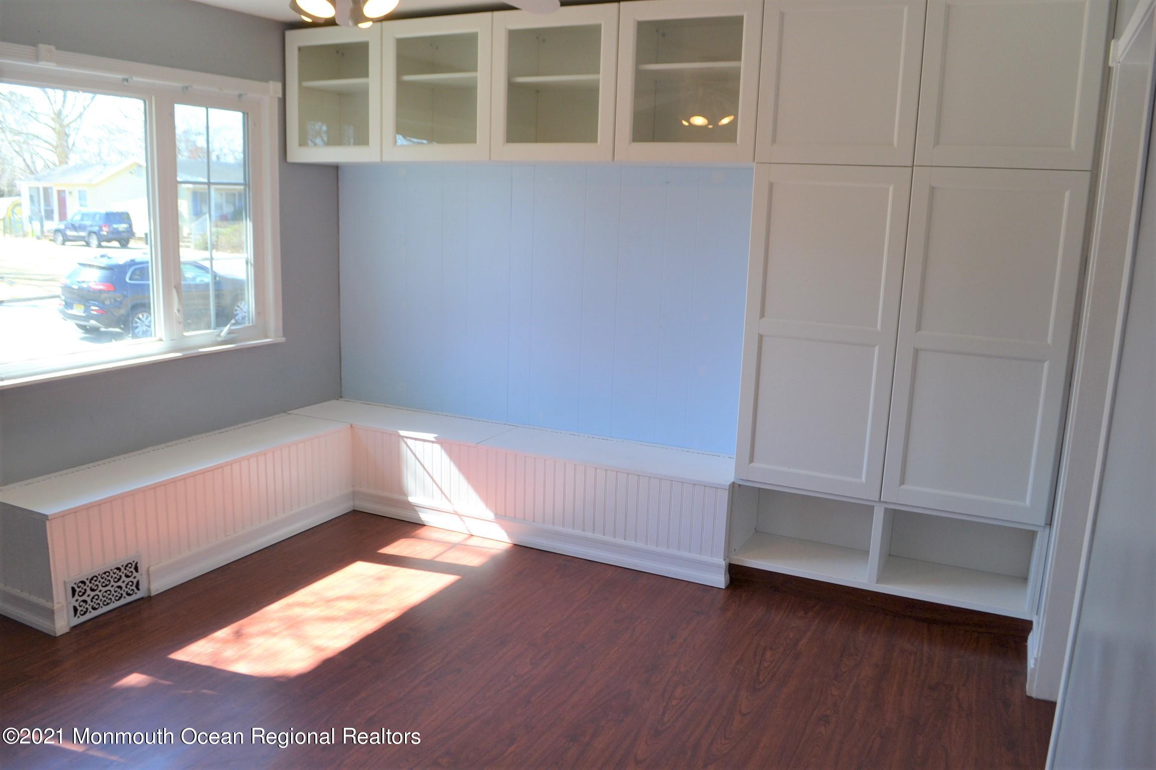 18 Castle Avenue Jackson, NJ 08527 - Photo 8 of 19 a view of empty room with wooden floor and fan