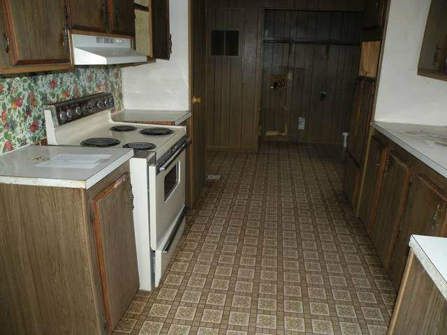 4674 Damron Valley Road Snowflake, AZ 85937 - Photo 13 of 19 a kitchen with a sink a stove and cabinets
