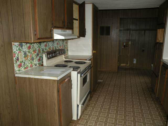 4674 Damron Valley Road Snowflake, AZ 85937 - Photo 5 of 19 a kitchen with stainless steel appliances granite countertop a stove a sink and a refrigerator
