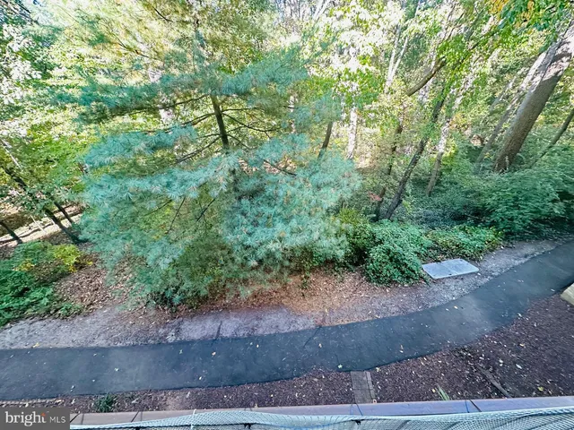 a balcony with trees in front of it