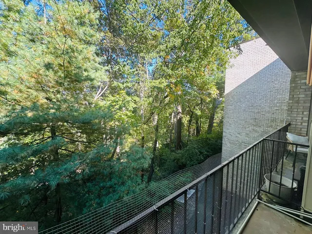 a view of a backyard with sitting area