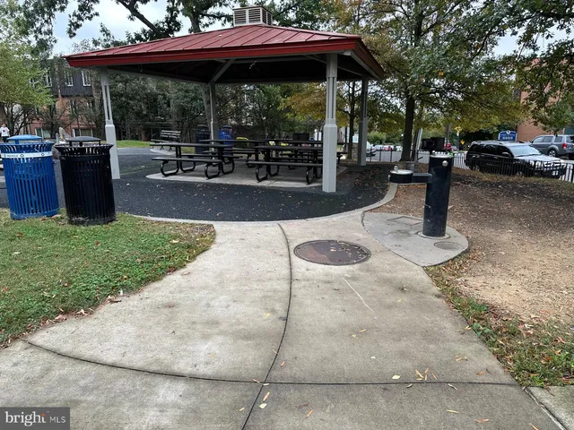 a view of a backyard with sitting area