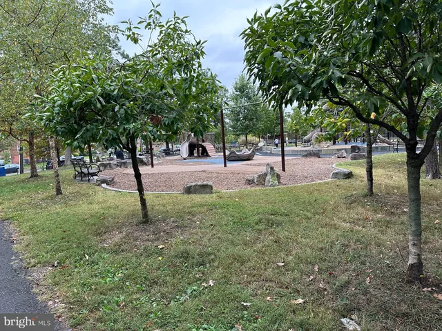 a view of a backyard with sitting area