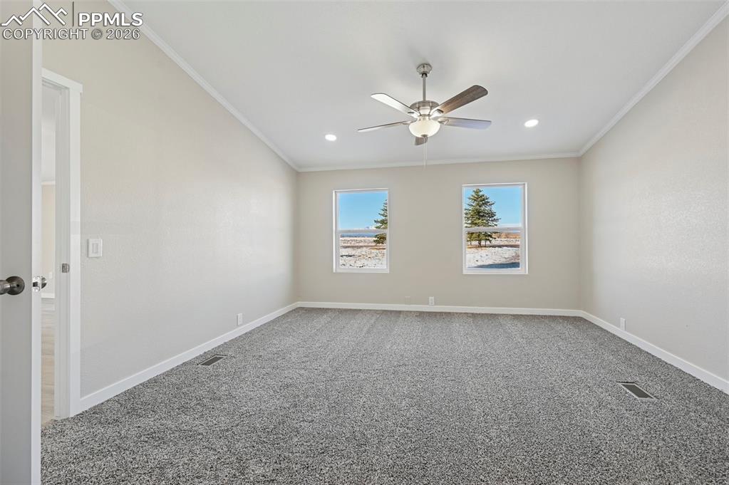 6315 Peerless Farms Road Peyton, CO 80831 - Photo 16 of 49 a view of an empty room with a window