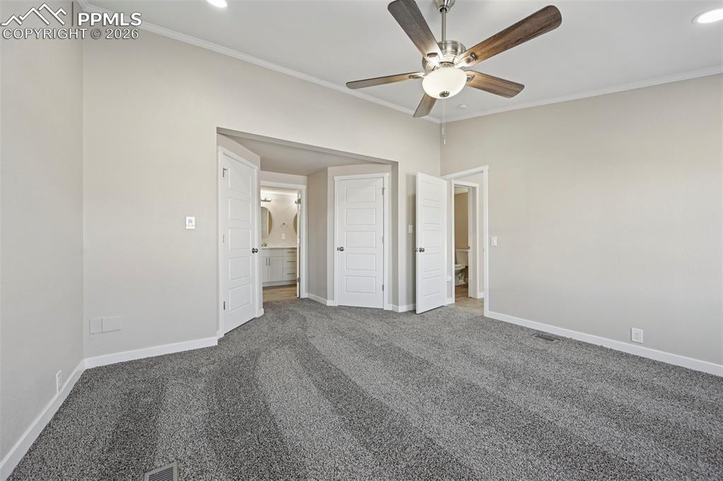 6315 Peerless Farms Road Peyton, CO 80831 - Photo 19 of 49 a view of an empty room with a ceiling fan