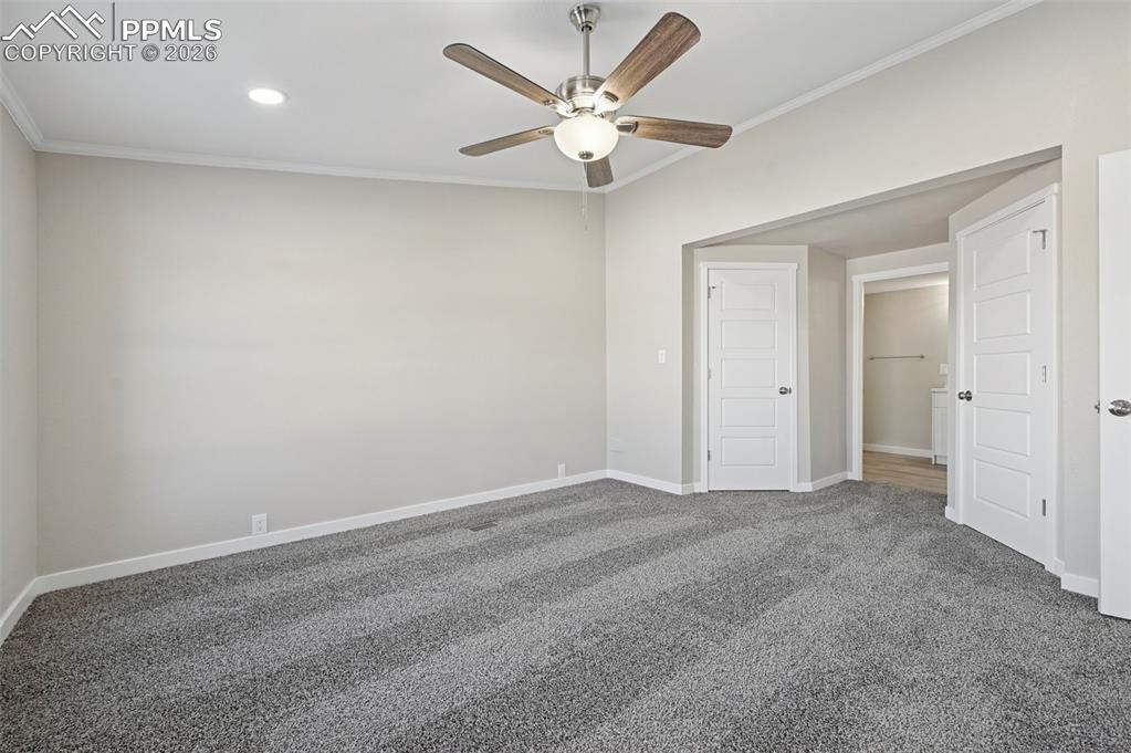 6315 Peerless Farms Road Peyton, CO 80831 - Photo 20 of 49 an empty room with chandelier fan