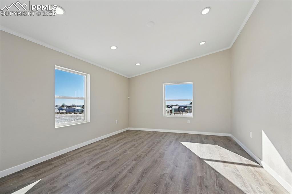 6315 Peerless Farms Road Peyton, CO 80831 - Photo 26 of 49 an empty room with a window and a ceiling fan