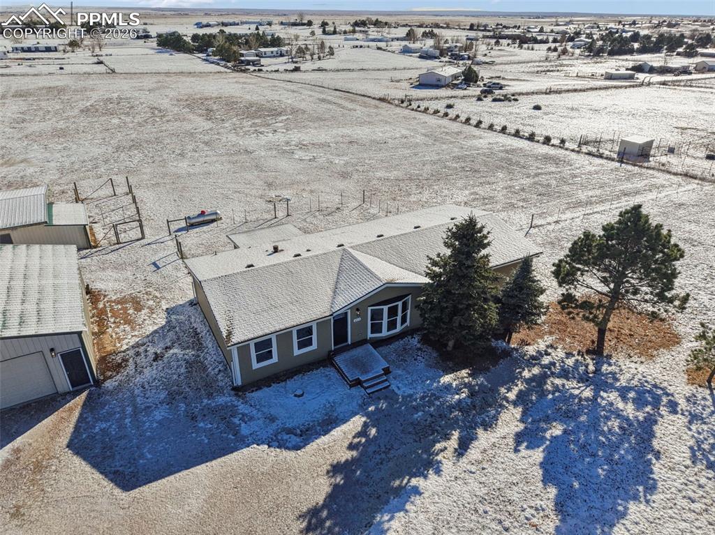 6315 Peerless Farms Road Peyton, CO 80831 - Photo 3 of 49 a view of a terrace with a outdoor space