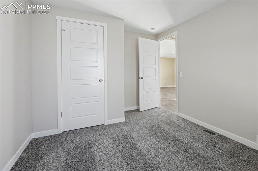 6315 Peerless Farms Road Peyton, CO 80831 - Photo 33 of 49 a view of an empty room