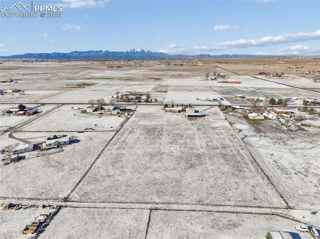 6315 Peerless Farms Road Peyton, CO 80831 - Photo 39 of 49 a view of an ocean and beach